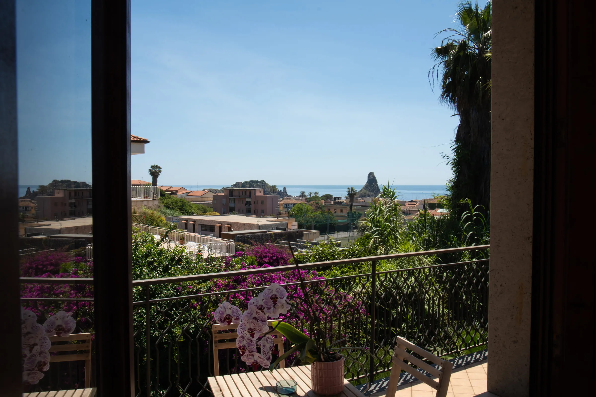 The view from the balcony across the village rooftops to the sea.