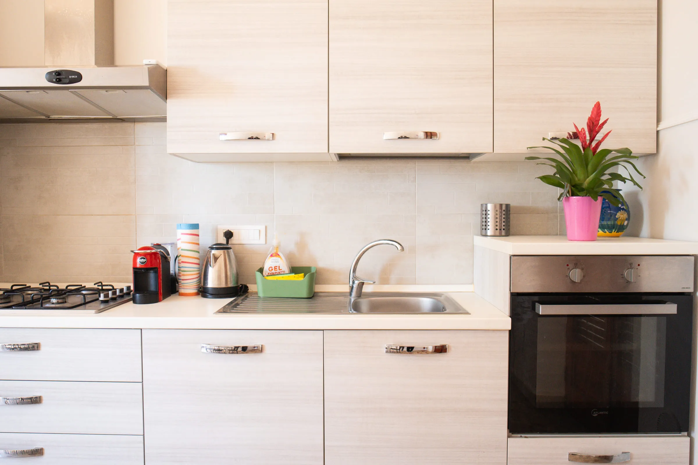Hob, sink and oven of the fitted kitchen.