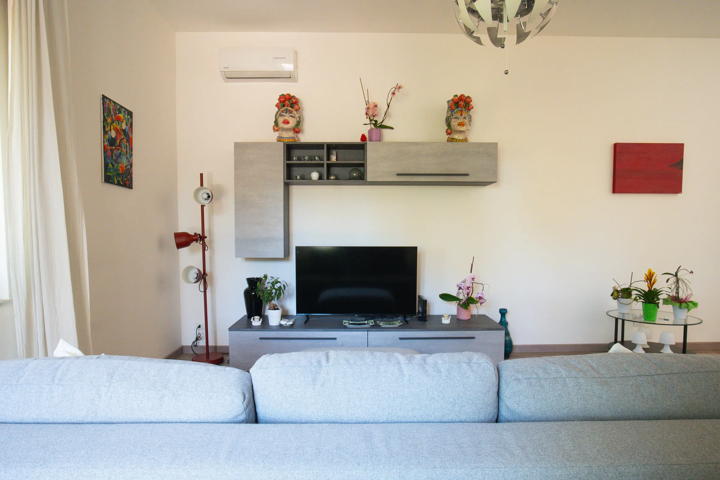 The living room's TV wall, seen from the sofa.